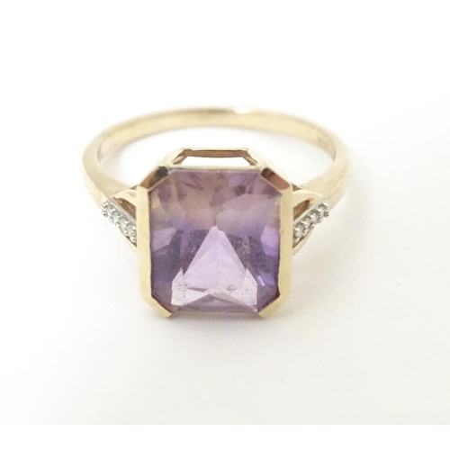 606 - A 9ct gold ring set with central Anahi ametrine flanked by diamonds to shoulders, together with a 9c... 