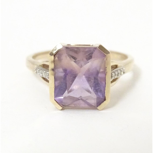 606 - A 9ct gold ring set with central Anahi ametrine flanked by diamonds to shoulders, together with a 9c... 