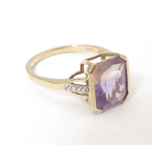 606 - A 9ct gold ring set with central Anahi ametrine flanked by diamonds to shoulders, together with a 9c... 