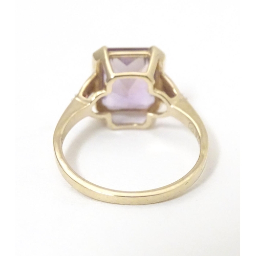 606 - A 9ct gold ring set with central Anahi ametrine flanked by diamonds to shoulders, together with a 9c... 