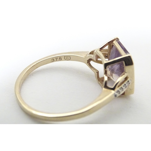 606 - A 9ct gold ring set with central Anahi ametrine flanked by diamonds to shoulders, together with a 9c... 