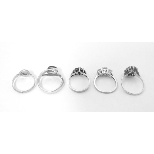 607 - Five assorted silver dress rings (5)