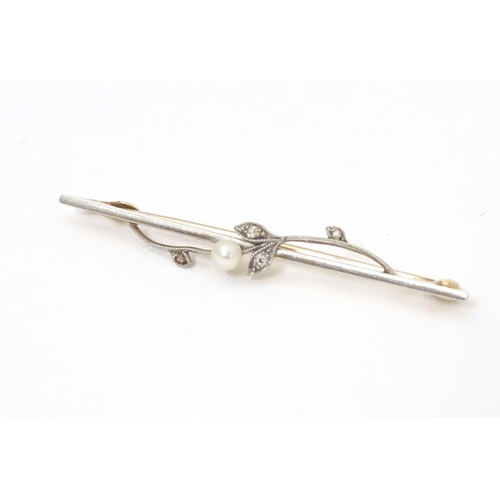 613 - A 15ct gold bar brooch set with pearl and diamonds. Approx. 2