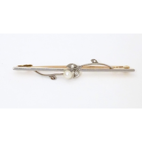 613 - A 15ct gold bar brooch set with pearl and diamonds. Approx. 2