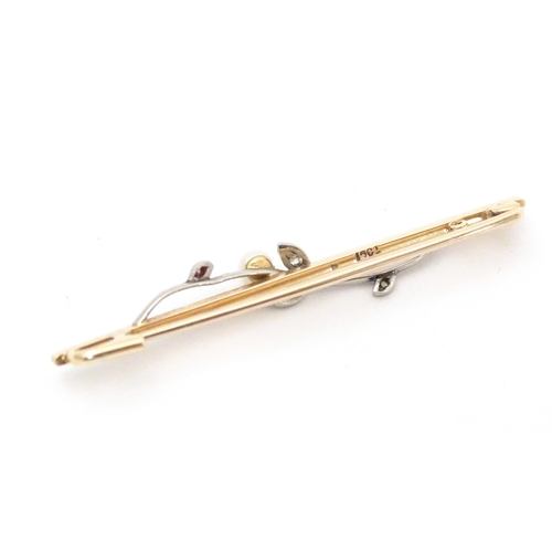 613 - A 15ct gold bar brooch set with pearl and diamonds. Approx. 2