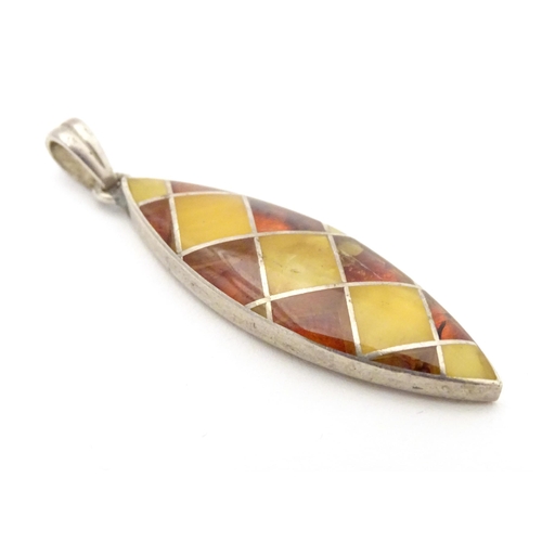 614 - A silver pendant set with amber detail 1 1/2