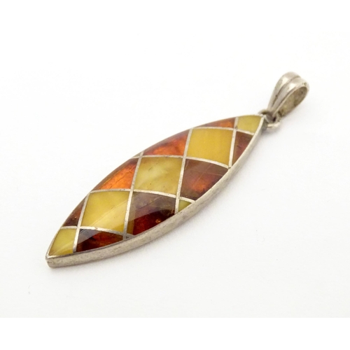 614 - A silver pendant set with amber detail 1 1/2