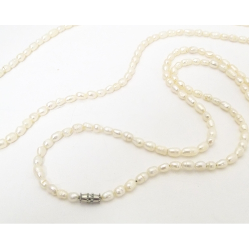 740 - A silver pendant necklace, together with a pearl necklace. Pearl necklace approx. 46