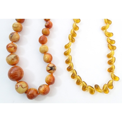 760 - A quantity of assorted bead necklaces to include some amber examples.