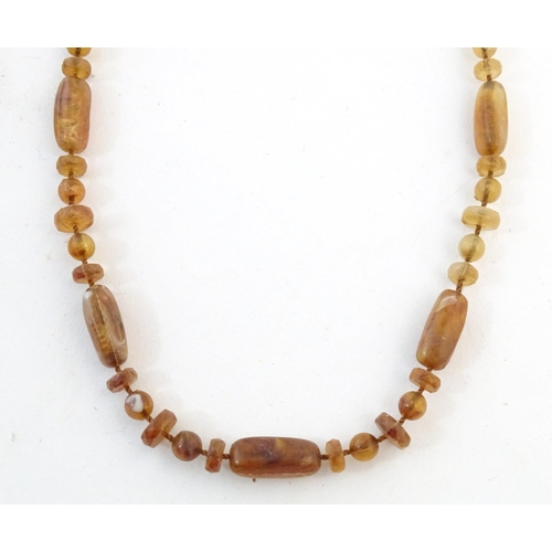 760 - A quantity of assorted bead necklaces to include some amber examples.