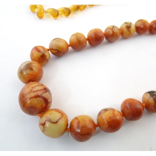 760 - A quantity of assorted bead necklaces to include some amber examples.