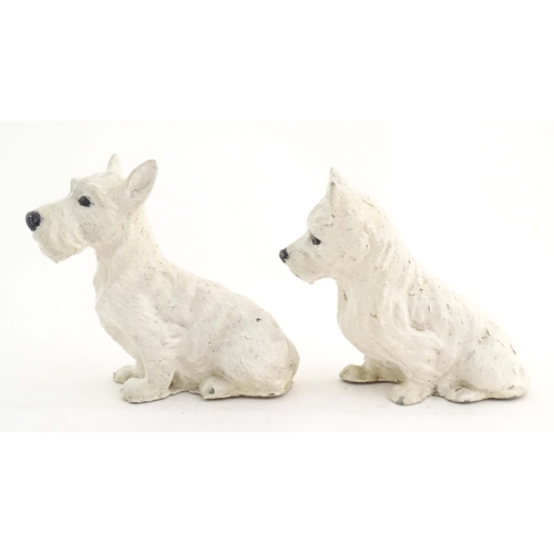 1008 - Two 20thC cast and painted models of seated terrier dogs. Approx. 7 1/2