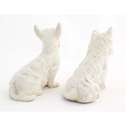 1008 - Two 20thC cast and painted models of seated terrier dogs. Approx. 7 1/2