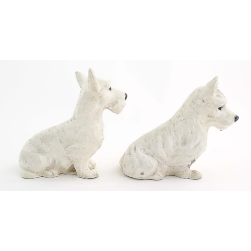 1008 - Two 20thC cast and painted models of seated terrier dogs. Approx. 7 1/2