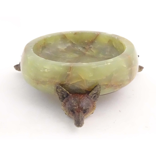 1009 - A 20thC green agate dish on an Austrian cold painted base with fox head detail. The stand marked Mad... 