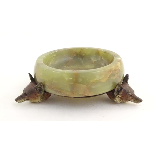 1009 - A 20thC green agate dish on an Austrian cold painted base with fox head detail. The stand marked Mad... 