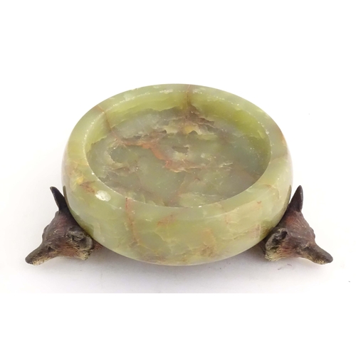 1009 - A 20thC green agate dish on an Austrian cold painted base with fox head detail. The stand marked Mad... 