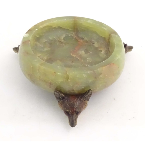 1009 - A 20thC green agate dish on an Austrian cold painted base with fox head detail. The stand marked Mad... 