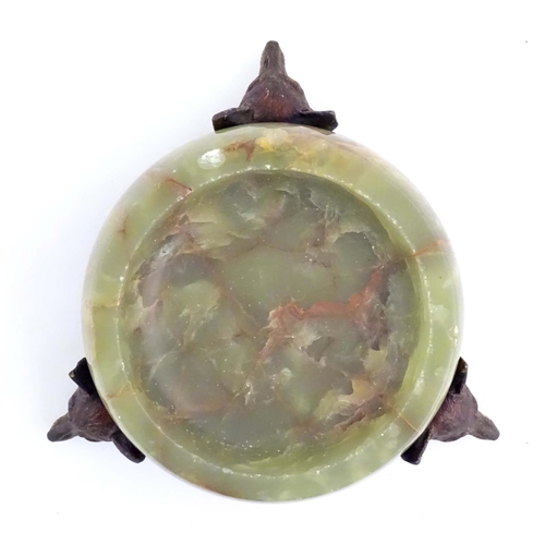 1009 - A 20thC green agate dish on an Austrian cold painted base with fox head detail. The stand marked Mad... 