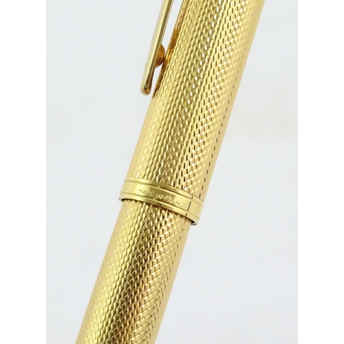 1150 - A cased Waterman, Paris 'Ideal' fountain pen, with engine turned decoration, gold plated finish and ... 