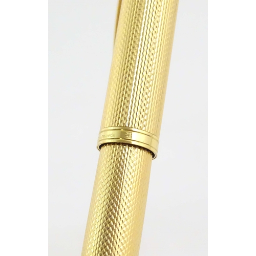 1150 - A cased Waterman, Paris 'Ideal' fountain pen, with engine turned decoration, gold plated finish and ... 