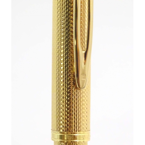 1150 - A cased Waterman, Paris 'Ideal' fountain pen, with engine turned decoration, gold plated finish and ... 