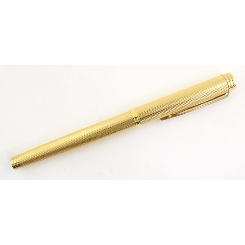 1150 - A cased Waterman, Paris 'Ideal' fountain pen, with engine turned decoration, gold plated finish and ... 