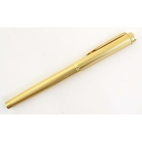 1150 - A cased Waterman, Paris 'Ideal' fountain pen, with engine turned decoration, gold plated finish and ... 