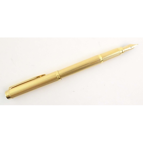 1150 - A cased Waterman, Paris 'Ideal' fountain pen, with engine turned decoration, gold plated finish and ... 