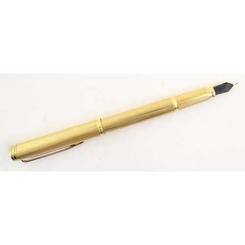 1150 - A cased Waterman, Paris 'Ideal' fountain pen, with engine turned decoration, gold plated finish and ... 