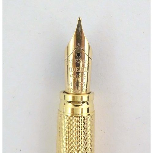 1150 - A cased Waterman, Paris 'Ideal' fountain pen, with engine turned decoration, gold plated finish and ... 