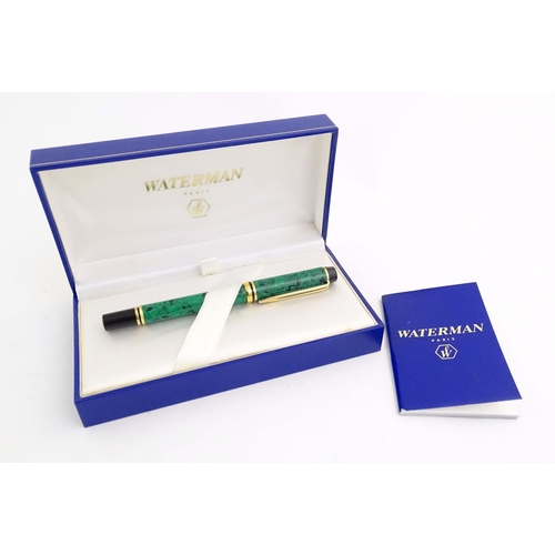 1151 - A cased Waterman 'Le Man 200' fountain pen, with green/black marbled finish and 18K gold nib. Approx... 