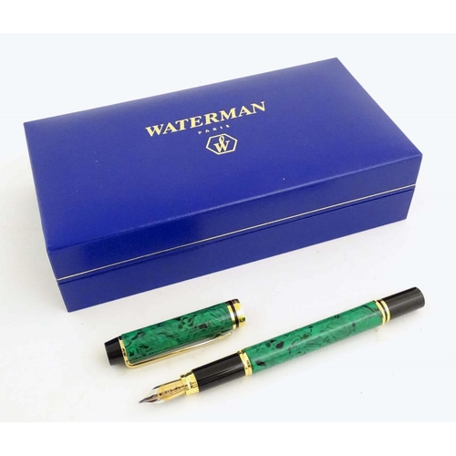 1151 - A cased Waterman 'Le Man 200' fountain pen, with green/black marbled finish and 18K gold nib. Approx... 