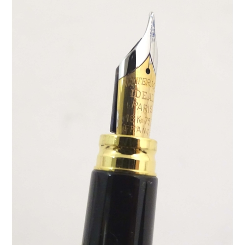 1151 - A cased Waterman 'Le Man 200' fountain pen, with green/black marbled finish and 18K gold nib. Approx... 