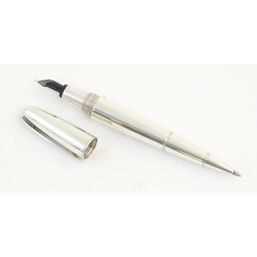 1152 - A cased silver Dunhill 'Torpedo' combination ballpoint & fountain dipping pen, hallmarked 2000 Londo... 