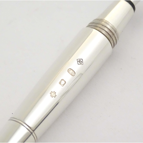 1152 - A cased silver Dunhill 'Torpedo' combination ballpoint & fountain dipping pen, hallmarked 2000 Londo... 