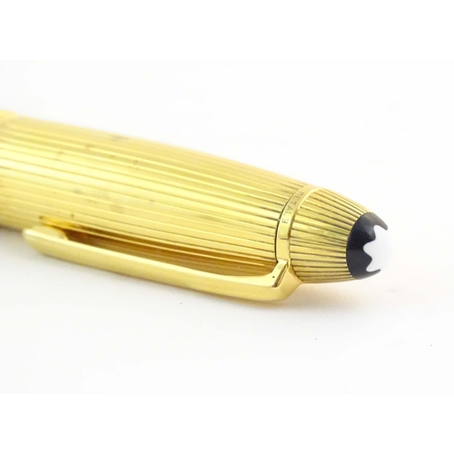 1153 - A cased Montblanc '146 Le Grand' silver gilt fountain pen, with linear decoration and 18K gold nib. ... 