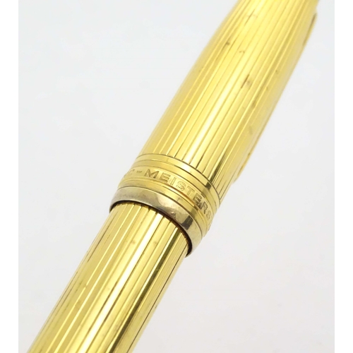 1153 - A cased Montblanc '146 Le Grand' silver gilt fountain pen, with linear decoration and 18K gold nib. ... 