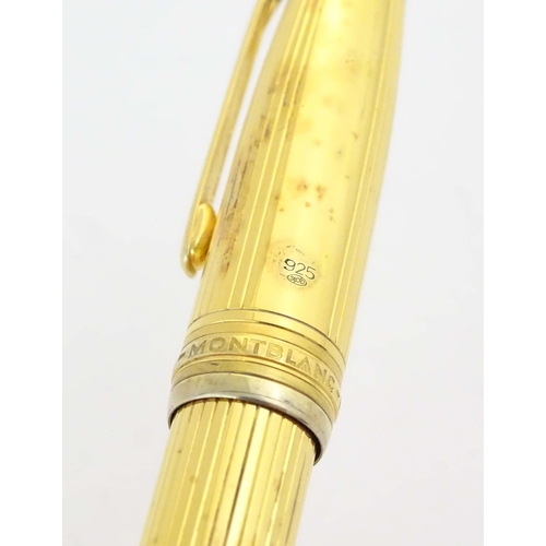 1153 - A cased Montblanc '146 Le Grand' silver gilt fountain pen, with linear decoration and 18K gold nib. ... 