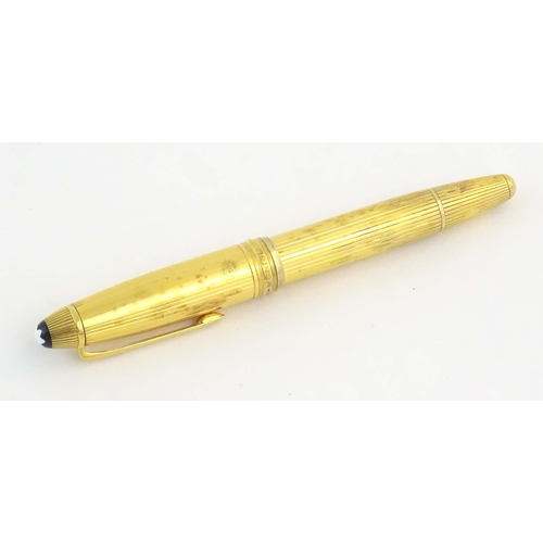 1153 - A cased Montblanc '146 Le Grand' silver gilt fountain pen, with linear decoration and 18K gold nib. ... 