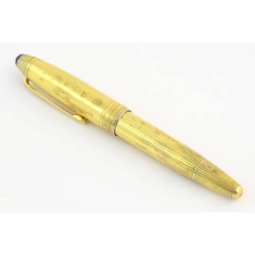 1153 - A cased Montblanc '146 Le Grand' silver gilt fountain pen, with linear decoration and 18K gold nib. ... 