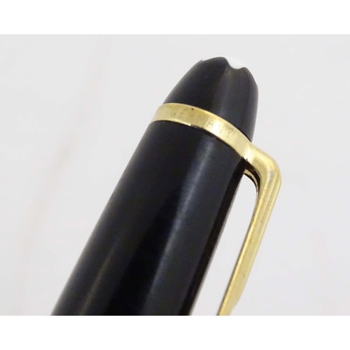 1154 - A cased Montblanc 'Meisterstuck' ballpoint pen, in black finish and decorated with gilt banding. App... 