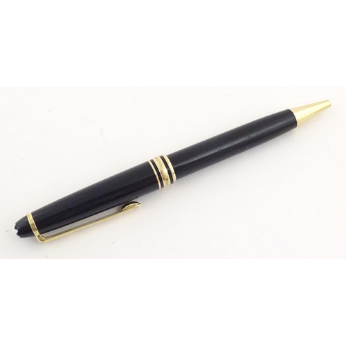 1154 - A cased Montblanc 'Meisterstuck' ballpoint pen, in black finish and decorated with gilt banding. App... 