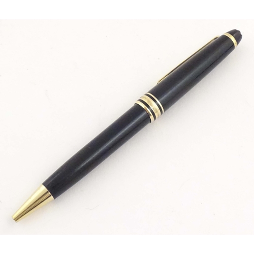 1154 - A cased Montblanc 'Meisterstuck' ballpoint pen, in black finish and decorated with gilt banding. App... 