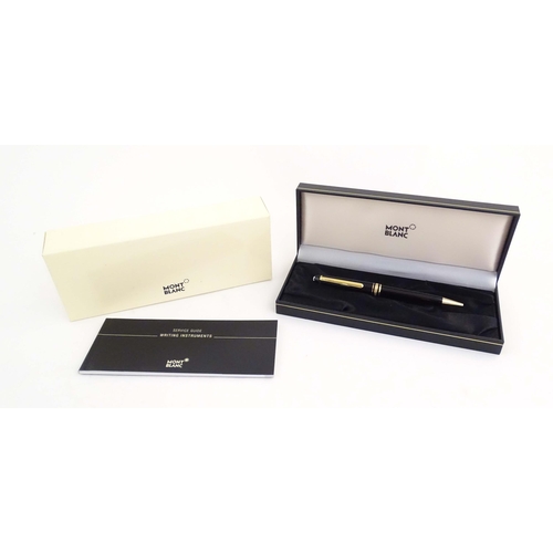 1155 - A cased Montblanc 'Meisterstuck' ballpoint pen, in black finish and decorated with gilt banding. App... 