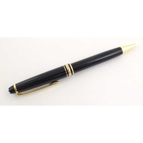 1155 - A cased Montblanc 'Meisterstuck' ballpoint pen, in black finish and decorated with gilt banding. App... 