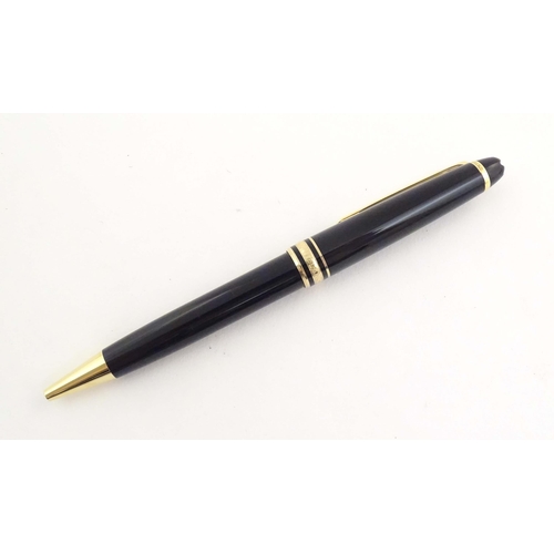 1155 - A cased Montblanc 'Meisterstuck' ballpoint pen, in black finish and decorated with gilt banding. App... 