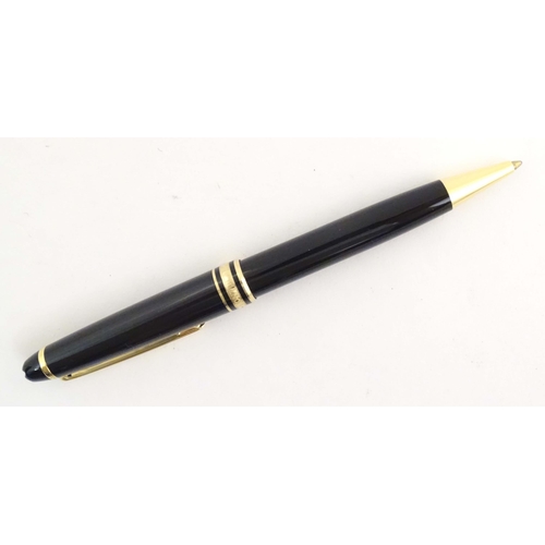 1155 - A cased Montblanc 'Meisterstuck' ballpoint pen, in black finish and decorated with gilt banding. App... 