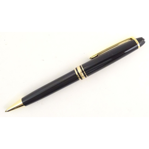 1155 - A cased Montblanc 'Meisterstuck' ballpoint pen, in black finish and decorated with gilt banding. App... 