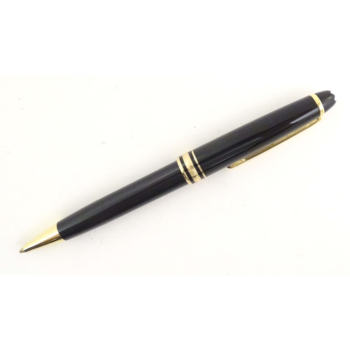 1155 - A cased Montblanc 'Meisterstuck' ballpoint pen, in black finish and decorated with gilt banding. App... 